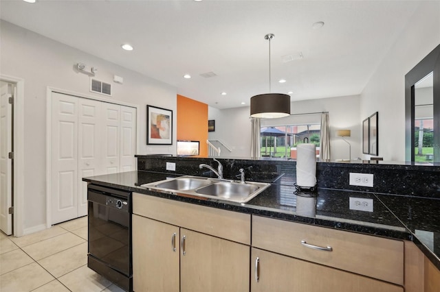 kitchen with dishwasher, light brown cabinetry, a healthy amount of sunlight, and sink