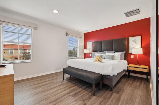 bedroom with hardwood / wood-style floors