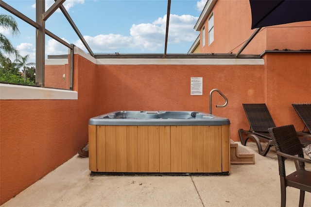 view of patio with a hot tub