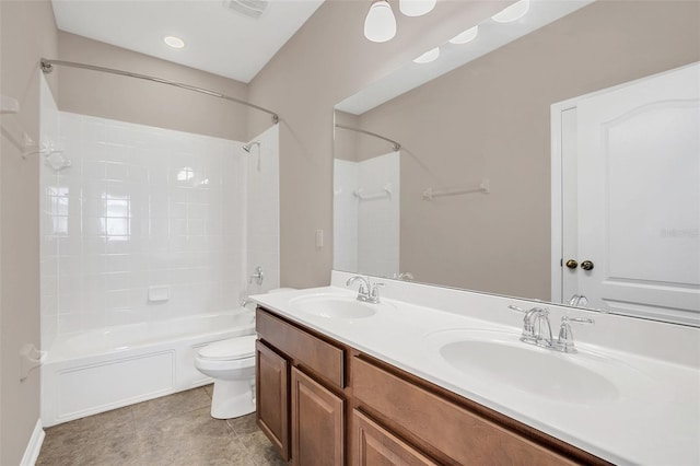 full bathroom featuring vanity, bathtub / shower combination, toilet, and tile patterned floors