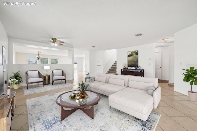 living room with ceiling fan and light tile patterned floors