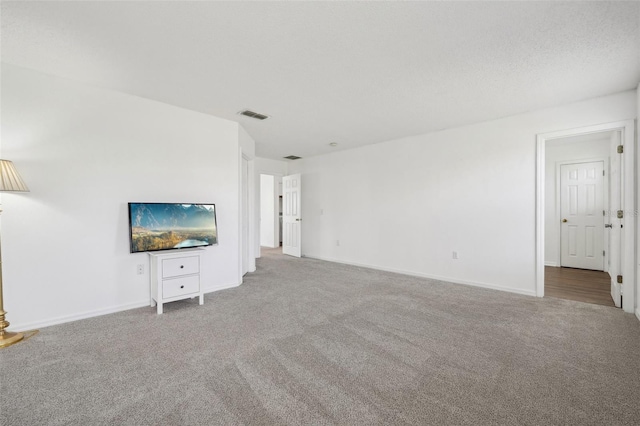 unfurnished living room with carpet flooring