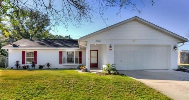 single story home featuring a front yard and a garage