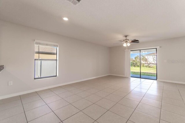 207 Goldenrod Ln, Kissimmee, FL 34759 - spare room featuring a ceiling fan, light tile patterned flooring, and baseboards