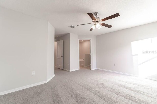 207 Goldenrod Ln, Kissimmee, FL 34759 - unfurnished room with light colored carpet, ceiling fan, and baseboards