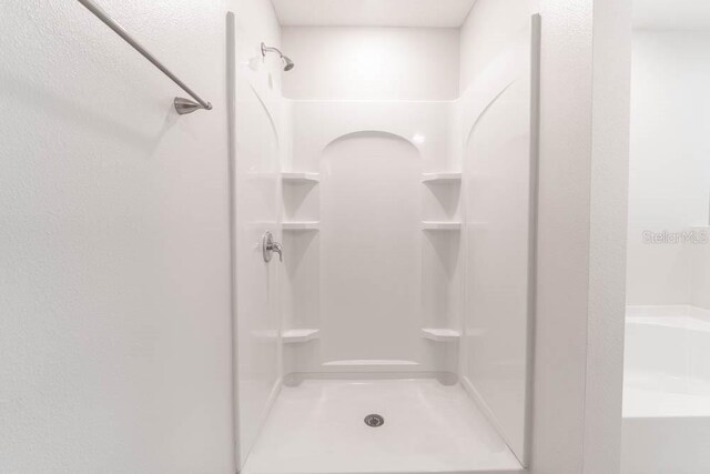 bathroom featuring walk in shower