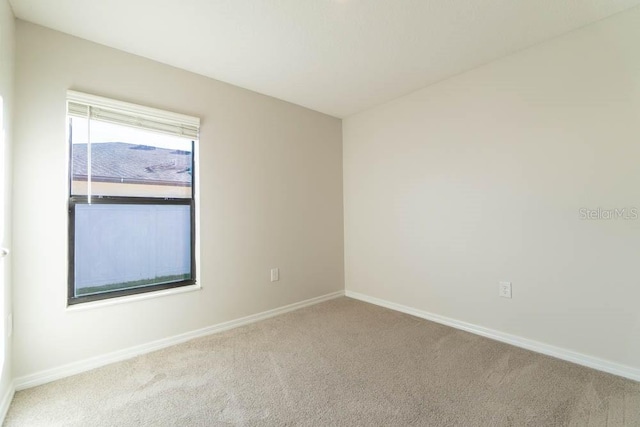 207 Goldenrod Ln, Kissimmee, FL 34759 - carpeted spare room featuring baseboards