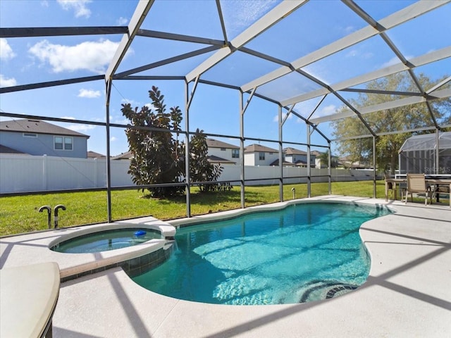 view of swimming pool with a patio, an in ground hot tub, a lawn, and a lanai