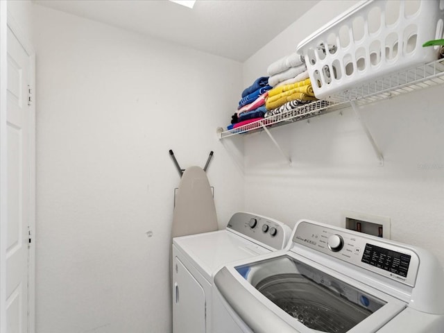 washroom featuring washer and dryer