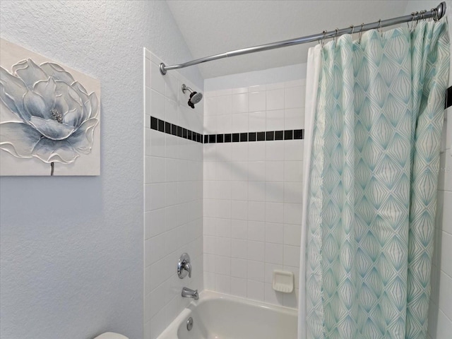 bathroom featuring shower / tub combo with curtain