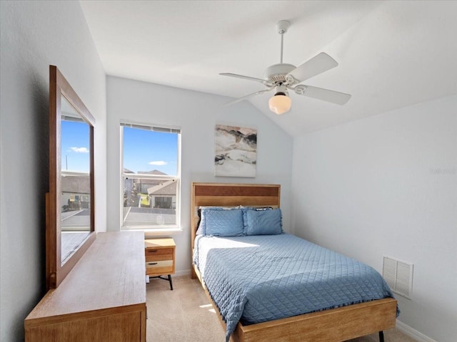 carpeted bedroom featuring ceiling fan and lofted ceiling