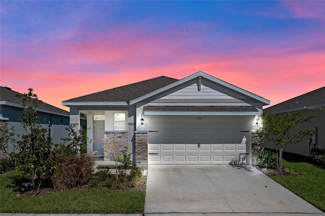 ranch-style house featuring a garage