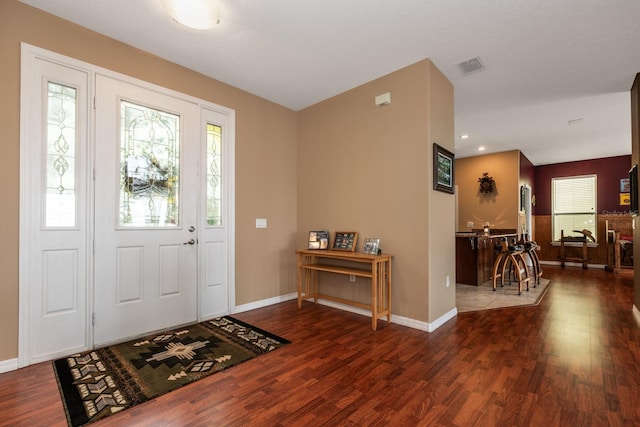 entrance foyer featuring dark hardwood / wood-style floors