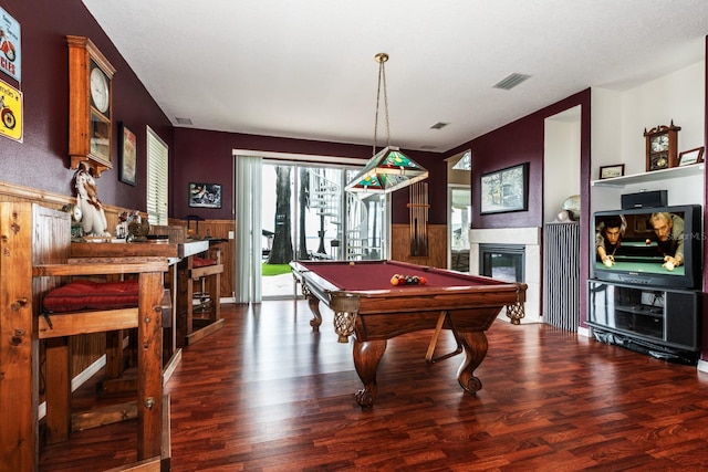 rec room featuring a fireplace, dark hardwood / wood-style floors, and pool table