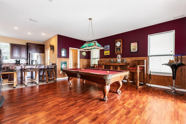 rec room with wooden walls, light hardwood / wood-style floors, and pool table