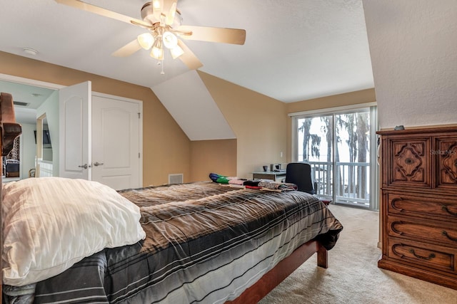 bedroom with light carpet, access to outside, vaulted ceiling, and ceiling fan