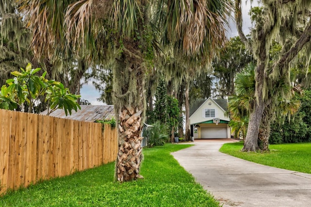 view of front facade with a front yard and a garage