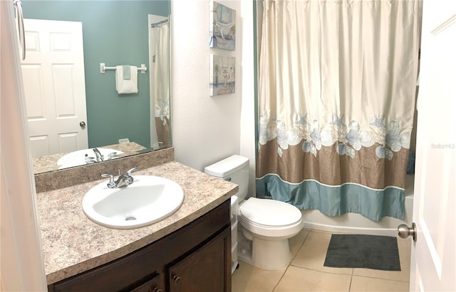 full bathroom featuring vanity, toilet, tile patterned flooring, and shower / tub combo with curtain