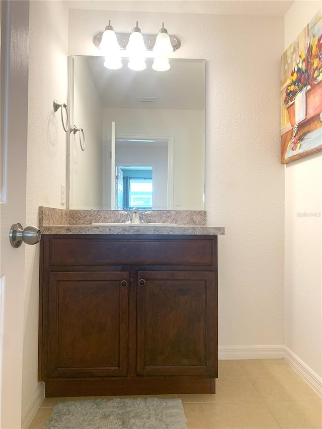 bathroom with vanity and tile patterned floors