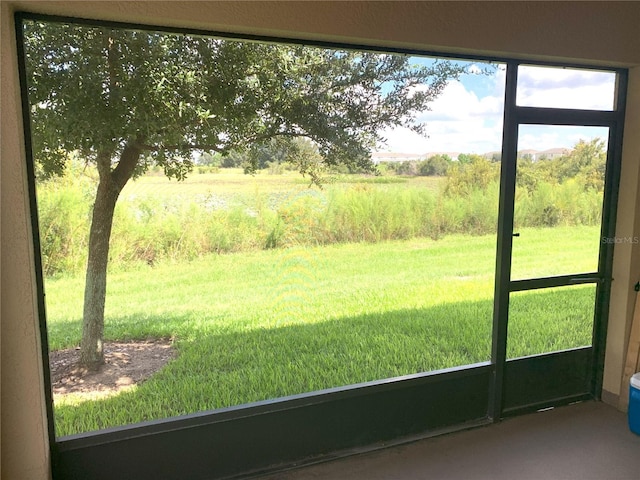 doorway to outside with a rural view