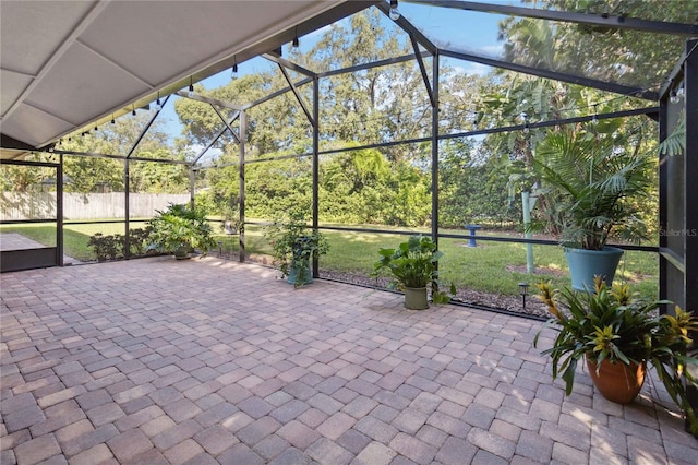 view of patio featuring a lanai