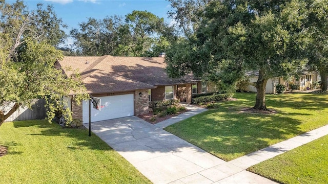 view of front of house featuring a front yard and a garage