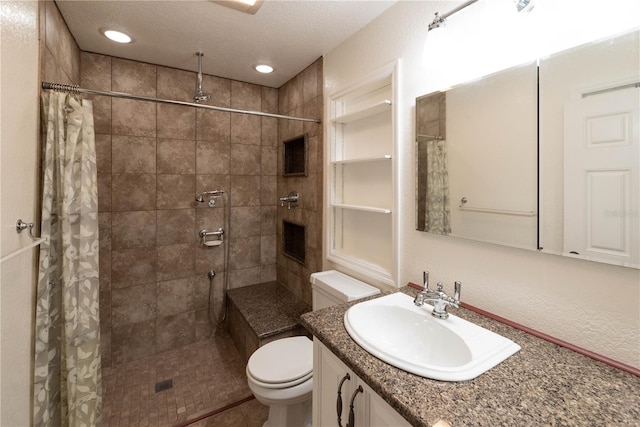 bathroom with a textured ceiling, a shower with shower curtain, toilet, tile patterned floors, and vanity