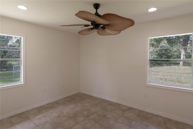 unfurnished room with ceiling fan