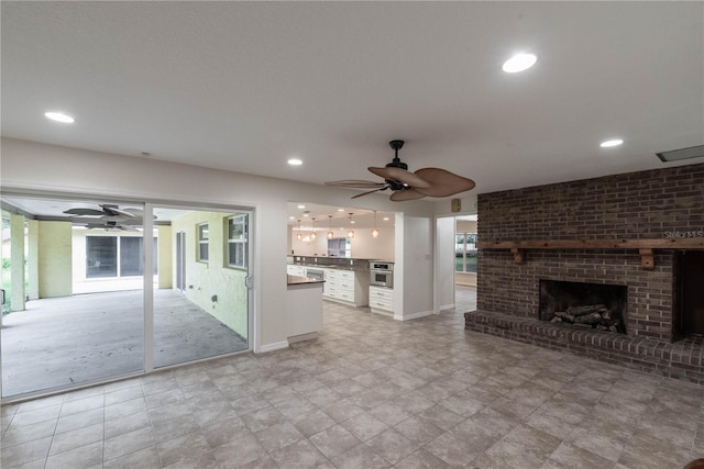 unfurnished living room featuring a brick fireplace