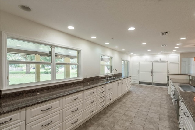 bathroom featuring tile patterned floors and sink