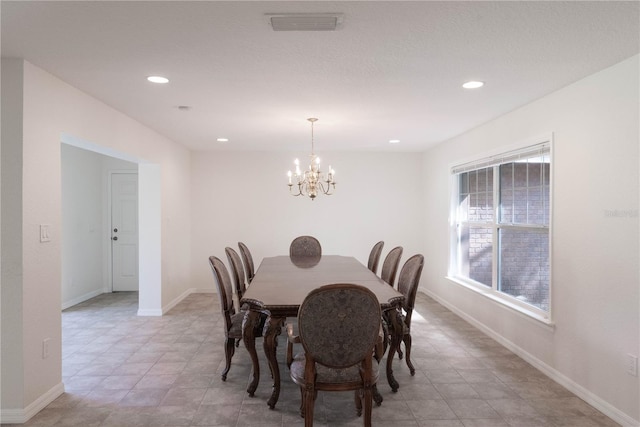 dining room with a notable chandelier