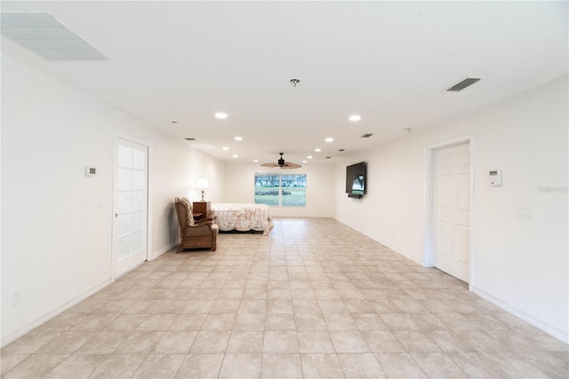 interior space with ceiling fan