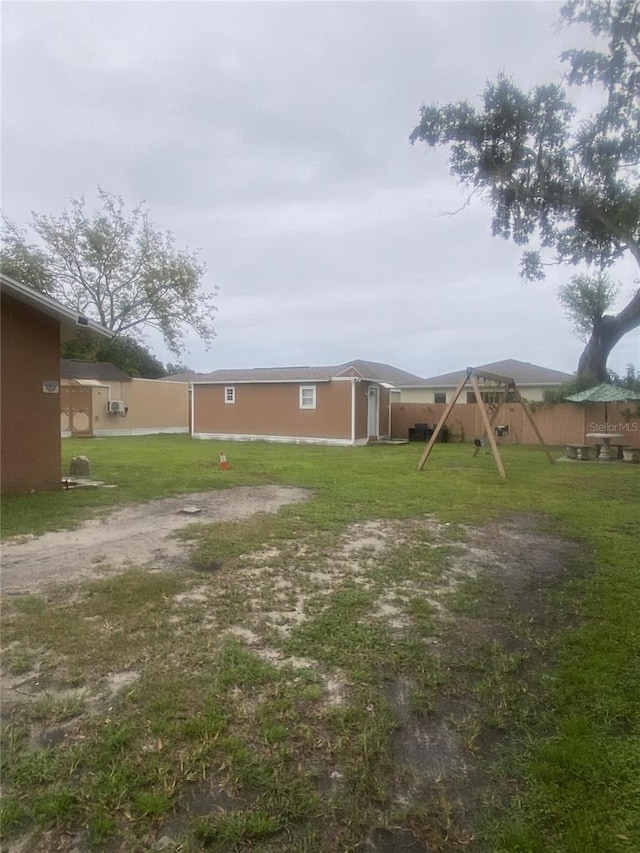 1801 Daniels St, Kissimmee, FL 34746 - view of grassy yard featuring a playground