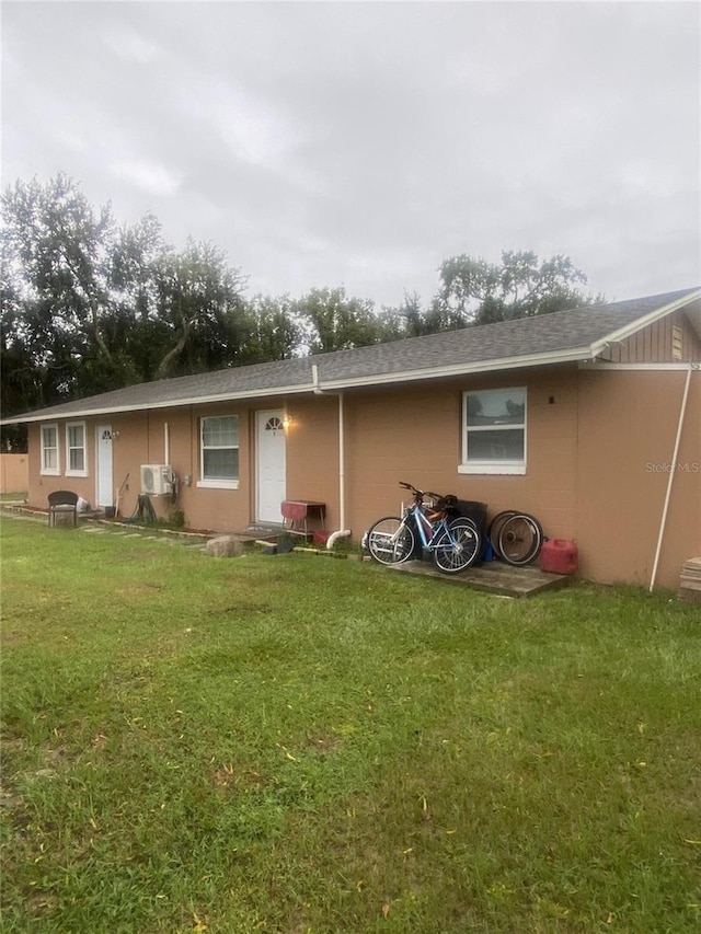 back of house featuring a yard