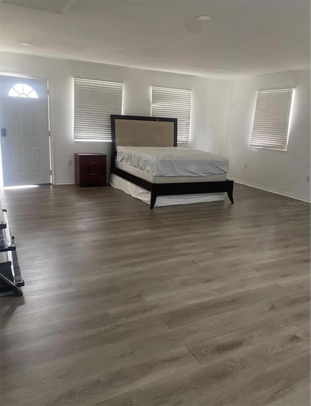 unfurnished bedroom featuring dark wood-type flooring