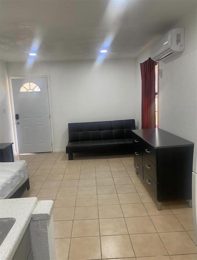 tiled living room with a wall mounted air conditioner