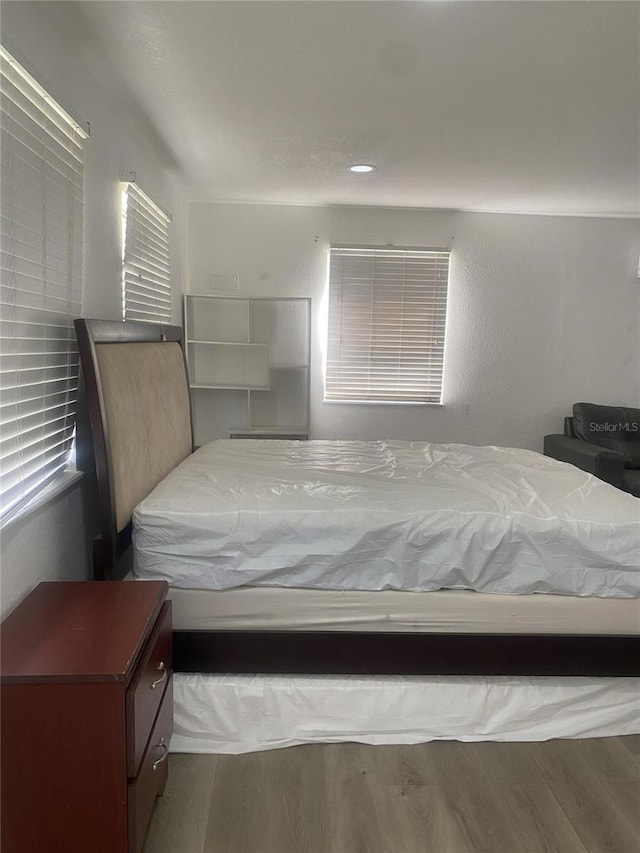 bedroom featuring hardwood / wood-style floors