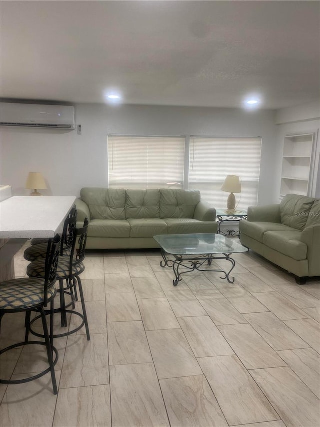 living room with a wall mounted air conditioner and built in shelves