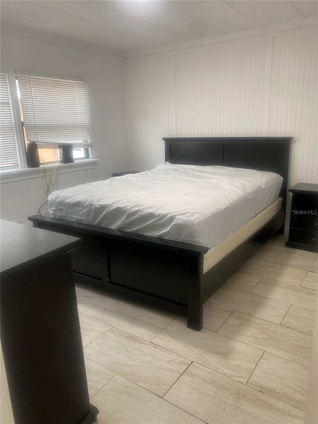 bedroom with ornamental molding