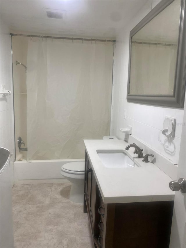 1801 Daniels St, Kissimmee, FL 34746 - bathroom with toilet, vanity, shower / bath combination with curtain, and tile patterned floors