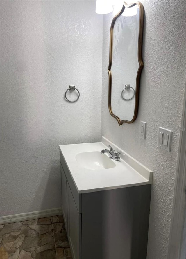 1801 Daniels St, Kissimmee, FL 34746 - bathroom with vanity and baseboards