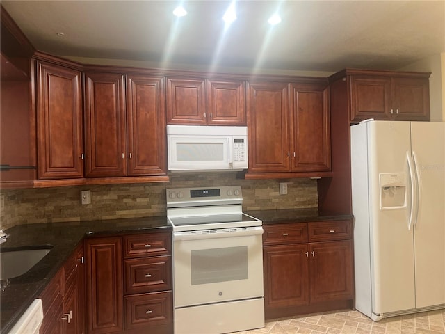 kitchen with sink, decorative backsplash, white appliances, and dark stone counters