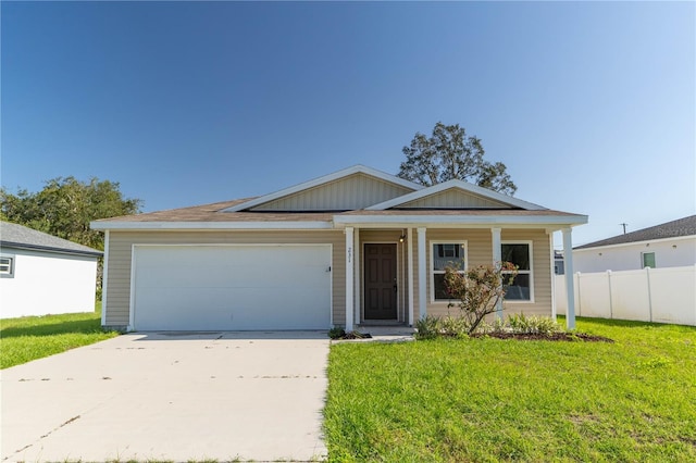 view of front of house featuring a front yard and a garage