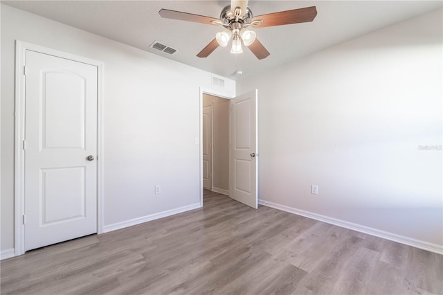 unfurnished bedroom with ceiling fan and light hardwood / wood-style floors