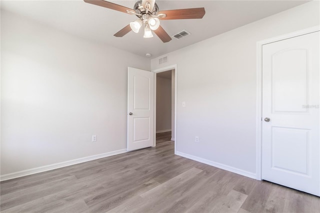 unfurnished bedroom featuring ceiling fan and light wood-type flooring