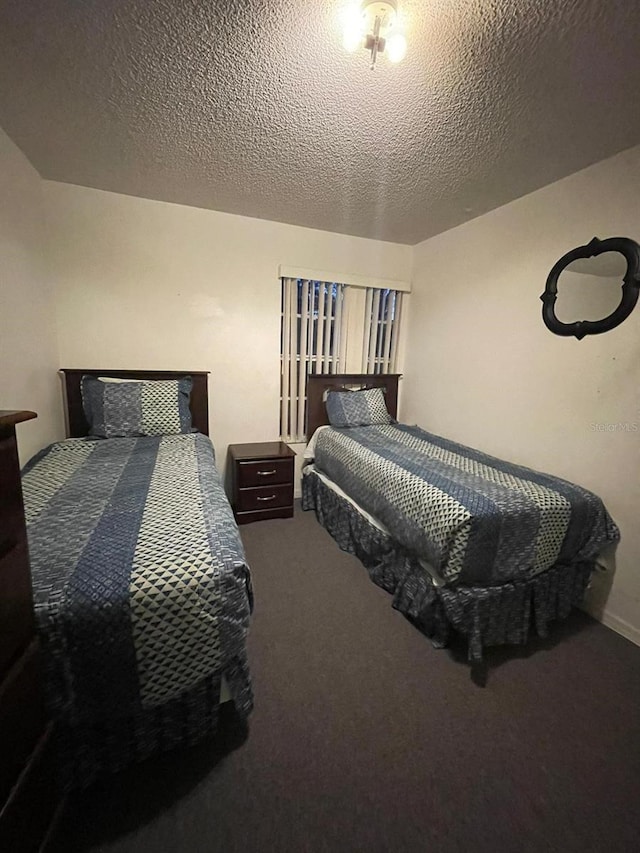 carpeted bedroom with a textured ceiling