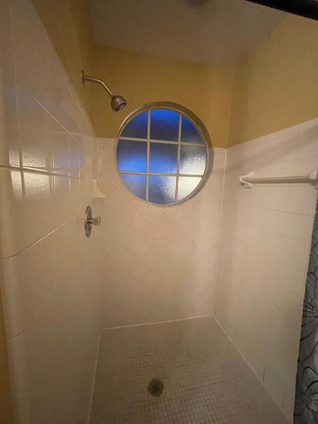 bathroom with a shower with shower curtain