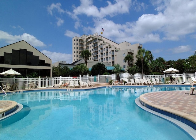 6165 Carrier Dr Unit 2113, Orlando, FL 32819 - community pool featuring fence and a patio