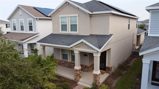 craftsman-style house with solar panels