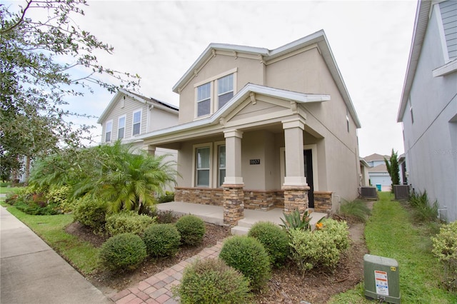 view of front of home featuring a porch and central air condition unit